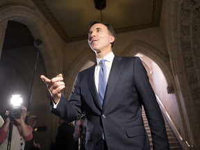 Finance Minister Bill Morneau arrives to talk to the media about tax changes for small businesses in Ottawa on Wednesday, Dec. 13, 2017.