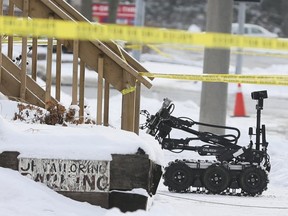 Durham Police investigate after remains were found along with a suspicious package in a basement apartment on McMillan Drive in Oshawa on Saturday, Dec. 30, 2017.