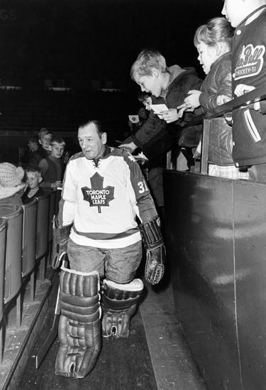 Toronto Maple Leafs' goaltender Johnny Bower leaves a team practice in Toronto in this 1970 file photo. Canadian hockey legend Johnny Bower has died. A statement from his family says the 93-year-old died after a short battle with pneumonia. THE CANADIAN PRESS ORG XMIT: CPT125