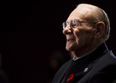 Canadian Second World War veteran and hockey hall of fame inductee Johnny Bower takes part in ceremony showing the new exhibit dedicated to First World War and Second World War veterans at the Hockey Hall of Fame in Toronto on November 10, 2014. Canadian hockey legend Johnny Bower has died. A statement from his family says the 93-year-old died after a short battle with pneumonia. THE CANADIAN PRESS/Nathan Denette ORG XMIT: CPT121