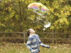 Kids enjoy some bubble fun at Kew Gardens chasing, catching and breaking bubbles on Saturday November 4, 2017. Jack Boland/Toronto Sun/Postmedia Network