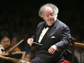 In this July 7, 2006 file photo, Boston Symphony Orchestra music director James Levine conducts the symphony on its opening night performance at Tanglewood in Lenox., Mass.