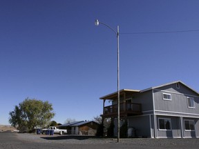 This Nov. 8, 2008, file photo shows the house in St. Johns, Ariz., where Vincent Romero and Timothy Romans, of San Carlos, Ariz., were found fatally shot. (AP Photo/Dana Felthauser, File)