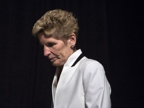 Ontario Premier Kathleen Wynne makes her way onto the stage as she attends the Confederation of Tomorrow 2.0 Conference in Toronto on Tuesday December 12, 2017. THE CANADIAN PRESS/Chris Young