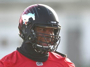 Calgary Stampeders Charleston Hughes shares a laugh on the sidelines during practice in preparation for the CFL Western Final in Calgary on Wednesday, November 15, 2017 against the Edmonton Eskimos.   Jim Wells/Postmedia