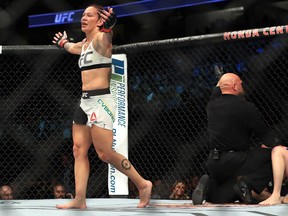 Cris Cyborg reacts to defeating Tonya Evinger during their featherweight title fight at UFC 214 on July 29, 2017