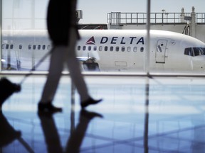 A Delta Air Lines jet sits at a gate at Hartsfield-Jackson Atlanta International Airport in Atlanta.