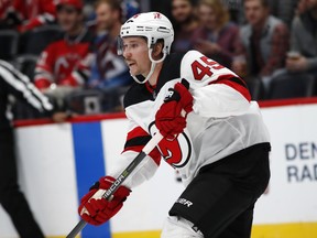 Defenceman Sami Vatanen passes the puck against the Avs in the first period of his New Jersey Devils debut on Friday. (AP Photo/David Zalubowski)