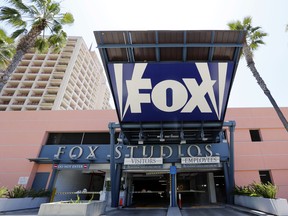 In this Tuesday, May 7, 2013, file photo, an entrance to a parking garage at 20th Century-Fox studios, an entity owned by News Corporation, is seen in Los Angeles. Disney announced Thursday, Dec. 14, 2017, that it is buying a large part of Fox, but the Fox studio lot in Los Angeles will remain with the Murdoch family. (AP Photo/Reed Saxon, File)