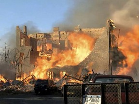 In this image taken from video provided by WRGB-TV, Albany, a fire burns in buildings, Thursday, Nov. 30, 2017, in downtown Cohoes, N.Y. An inferno that destroyed or damaged nearly two dozen buildings in a city in upstate New York was sparked by an amateur bladesmith who apparently was trying to imitate something he saw on TV, officials said. "It is the worst disaster the city has ever seen," Mayor Shawn Morse told reporters at an evening news conference. (WRGB-TV, Albany via AP)