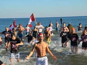 Courage Polar Bear Dip participants get a blast of New Year's Day at the 2017 event at Coronation Park, Oakville.