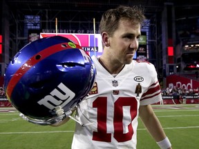 New York Giants quarterback Eli Manning (10) leaves the field after an NFL football game against the Arizona Cardinals, Sunday, Dec. 24, 2017, in Glendale, Ariz. The Cardinals won 23-0. (AP Photo/Rick Scuteri)