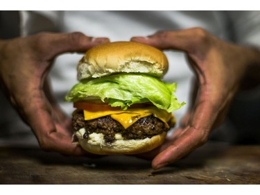 The Holy Burger, prepared by Aleem Syed, owner of Toronto food truck called - The Holy Grill - in Toronto, Ont. on Friday December 1, 2017. Syed was paralyzed from waist down after being shot in a 2008 random shooting and has the first wheelchair accessible food truck.