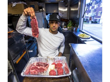 Aleem Syed, owner of Toronto food truck called - The Holy Grill -  poses with chuck of beef destined for a steak frites dish as he demonstrates food preparation in Toronto, Ont. on Friday December 1, 2017.