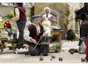 Santons playing "petanques" are pictured in the village of Aubagne, near Marseille, southern France, Thursday, Nov. 30, 2017.