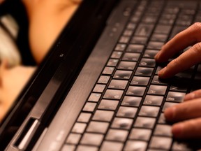 In this stock photo, a man views internet pornography on a computer.