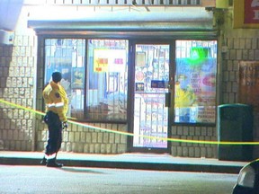 A Hamilton Police officer is pictured after the murder of Good Samaritan Yosif Al-Hasnawi. (Andrew Collins photo)