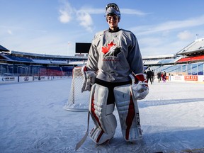 Canada goalie Carter Hart stands on the ice during their outdoor hockey practice at New Era Field on Dec. 28, 2017