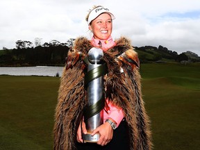 Brooke Henderson poses with the New Zealand Women's Open trophy by MC Kim on Oct. 2, 2017