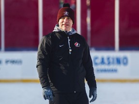 Canada's head coach Dominique Ducharme stands on the ice during their outdoor hockey practice at New Era Field during the IIHF World Junior Championship in Orchard Park, N.Y., Thursday, December 28, 2017.