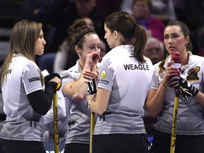 Team Homan skip Rachel Homan, second Joanne Courtney, lead Lisa Weagle and third Emma Miskew talk after a losing to Team Carey at the 2017 Roar of the Rings Canadian Olympic Curling Trials in Ottawa on Saturday, Dec. 2, 2017.