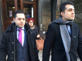 Lawyer Daniel Brown, left, and Mustafa Ururyar leave Old City Hall on Wednesday, Dec. 13, 2017. (Sam Pazzano/Toronto Sun)