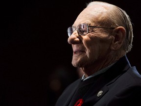 Hockey Hall of Famer Johnny Bower takes part in ceremony showing the new exhibit dedicated to First World War and Second World War veterans at the Hockey Hall of Fame in Toronto on November 10, 2014.