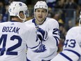 Toronto Maple Leafs' James van Riemsdyk celebrates his goal with Tyler Bozak and Nazem Kadri on Nov. 11, 2017