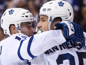 Toronto Maple Leafs' Patrick Marleau and James van Riemsdyk celebrate a goal against the Vancouver Canucks on Dec. 2, 2017