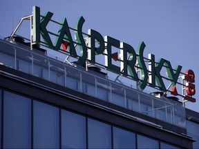 This Monday, Jan. 30, 2017, file photo shows a sign above the headquarters of Kaspersky Lab in Moscow. Britain's cybersecurity agency has told government departments not to use antivirus software from Moscow-based firm Kaspersky Lab, it was reported Saturday, Dec. 2, 2017. (AP Photo/Pavel Golovkin, File)