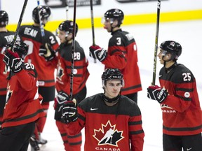Team Canada players salute the crowd following their victory over Team Czech Republic on Dec. 21, 2017