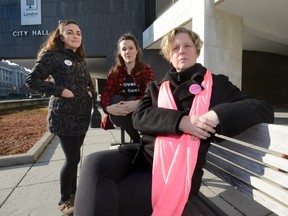 Julie Baumann, of SafeSpace, AnnaLise Trudel, of Anova, and Jodi Hall, of Fanshawe College, at London's City Hall where they are pushing to remove the no touch rule from the bylaws governing strips clubs and body rub parlours. (MORRIS LAMONT/THE LONDON FREE PRESS) /POSTMEDIA NETWORK