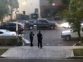 This photo provided by Basileus Zeno shows police at the scene of an active shooting in Long Beach, Calif. Friday, Dec. 29, 2017. Police say there are multiple victims at the scene but nothing about the number or their conditions. (Basileus Zeno via AP)