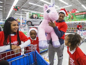 As a part of Kyle Lowry’s Holiday Assist program, 26 students from St. Stephen Catholic School got a chance to spend $400 on whatever they wanted from the Toys "R" Us Sherway Gardens location. (ERNEST DOROSZUK/TORONTO SUN)