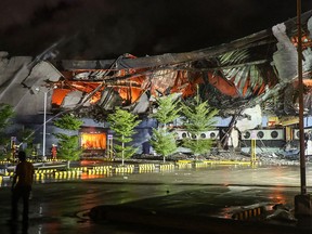 This photo taken on Dec. 23, 2017 shows firefighters extinguishing a fire at a shopping mall in Davao City on the southern Philippine island of Mindanao. (MANMAN DEJETO/AFP/Getty Images)