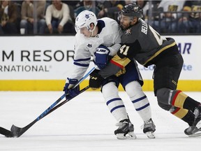 Vegas Golden Knights left wing Pierre-Edouard Bellemare (41) and Toronto Maple Leafs center Mitchell Marner (16) vie for the puck during the third period of an NHL hockey game, Sunday, Dec. 31, 2017, in Las Vegas.