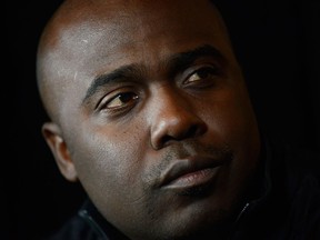 NFL Network analyst Marshall Faulk talks with the media during the NFL Draft Media Luncheon on April 29, 2015