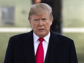 President Donald Trump boards Air Force One for a trip to Salt Lake City, Monday, Dec. 4, 2017, in Andrews Air Force Base, Md.