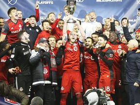 Toronto FC captain Michael Bradley hoists the eastern Conference Cup after defeating the Columbus Crew 1-0 to win the Eastern Final advancing to the MLS Cup  in Toronto, Ont. on Thursday November 30, 2017. Jack Boland/Toronto Sun/Postmedia Network