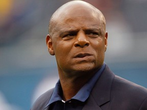 NFL Hall of Famer Warren Moon watches warmups before an NFL game on Dec. 2, 2012