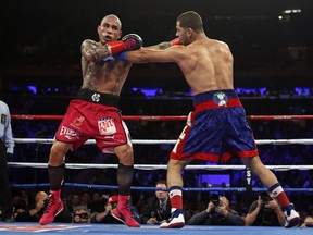 Miguel Cotto, left, of Puerto Rico, and Sadam Ali trade blows during the second round of a WBO junior middleweight title boxing match Saturday, Dec. 2, 2017, in New York.
