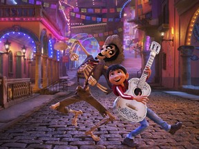 In this image released by Disney-Pixar, character Hector, voiced by Gael Garcia Bernal, left, and Miguel, voiced by Anthony Gonzalez, appear in a scene from the animated film, "Coco."