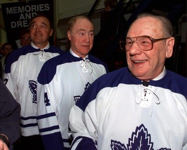 Former Toronto Maple Leafs stars Frank Mahovlich, left to right, Red Kelly and Johnny Bower take a final look at the depths of Maple Leaf Gardens as they prepare to head on to the ice for the closing ceremonies following the Leafs final game in the Gardens in Toronto on February 13, 1999. THE CANADIAN PRESS/Frank Gunn