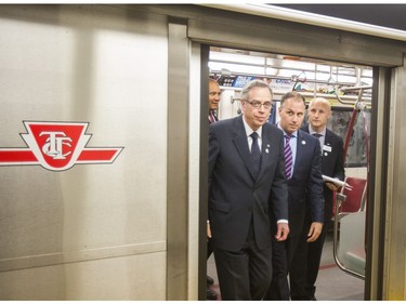 Federal Finance Minister Joe Oliver (left), TTC Chair Josh Colle and TTC CEO Andy Byford exit a subway train for  TTC news conference announcing the completion of the Union Subway Station renovations at Union Station in Toronto, Ont.  on Thursday July 2, 2015. Ernest Doroszuk/Toronto Sun/Postmedia Network