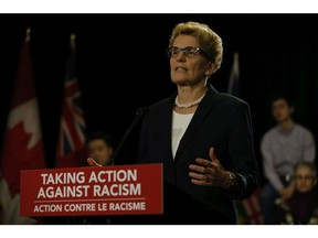 Ontario Premier Kathleen Wynne and Michael Coteau make and announcement about Taking Action Against Racism before the opening of the Legislature on Tuesday February 16, 2016.