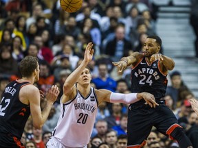 Toronto Raptors Norman Powell  during 1st half action against the Brooklyn Nets Timofey Mozgov at the Air Canada Centre in Toronto, Ont. on Friday December 15, 2017. Ernest Doroszuk/Toronto Sun/Postmedia Network ORG XMIT: POS1712151945131479
