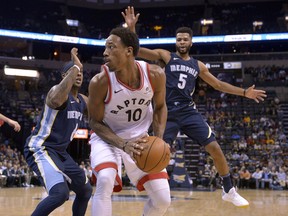Toronto Raptors guard DeMar DeRozan (10) controls the ball against Memphis Grizzlies guards Mario Chalmers (6) and Andrew Harrison (5) in the first half of an NBA basketball game Friday, Dec. 8, 2017, in Memphis, Tenn. The Associated Press