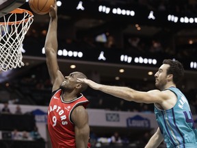 Toronto Raptors' Serge Ibaka (9) dunks past Charlotte Hornets' Frank Kaminsky (44) during the second half of an NBA basketball game in Charlotte, N.C., Wednesday, Dec. 20, 2017. The Associated Press
