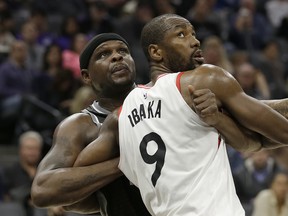 Sacramento Kings forward Zach Randolph , left, and Toronto Raptors forward Serge Ibaka battle for rebounding position during the second half of an NBA basketball game Sunday, Dec. 10, 2017, in Sacramento, Calif. The Associated Press