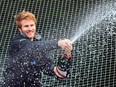 French skipper Francois Gabart sprays champagne upon his arrival at the end of his solo around the world navigation, on Dec. 17, 2017 in Brest, western France. (DAMIEN MEYER/AFP/Getty Images)